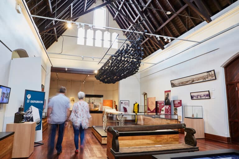 Visitors walking through the museum