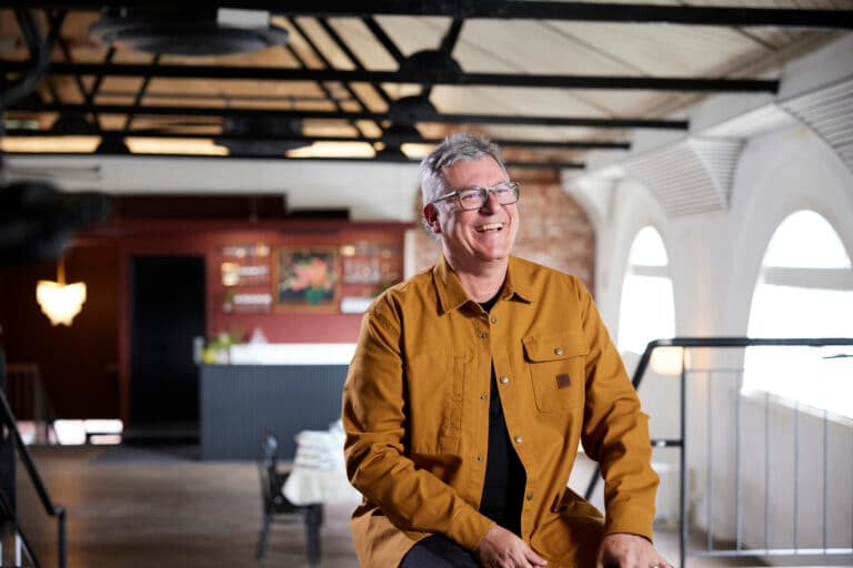 Kent Lyon standing in the Old Lyric Theatre.