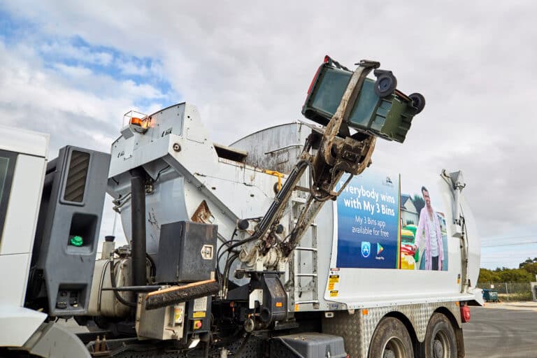 Rubbish truck collecting a bin